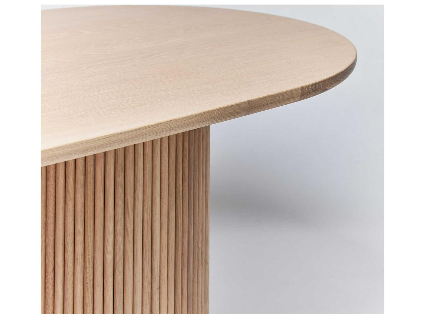 Laurel Oval Wood Saddle Dining Table with Fluted Pedestals