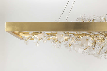 Jasmine 60" Wide LED Suspension Linear Chandelier with Flower Motif Centerpiece